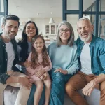 Happy Family sitting together on a couch.