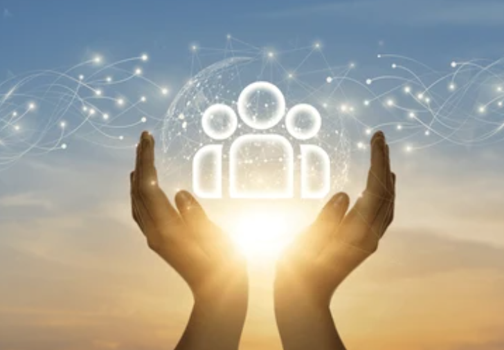 Hands holding glowing human figures